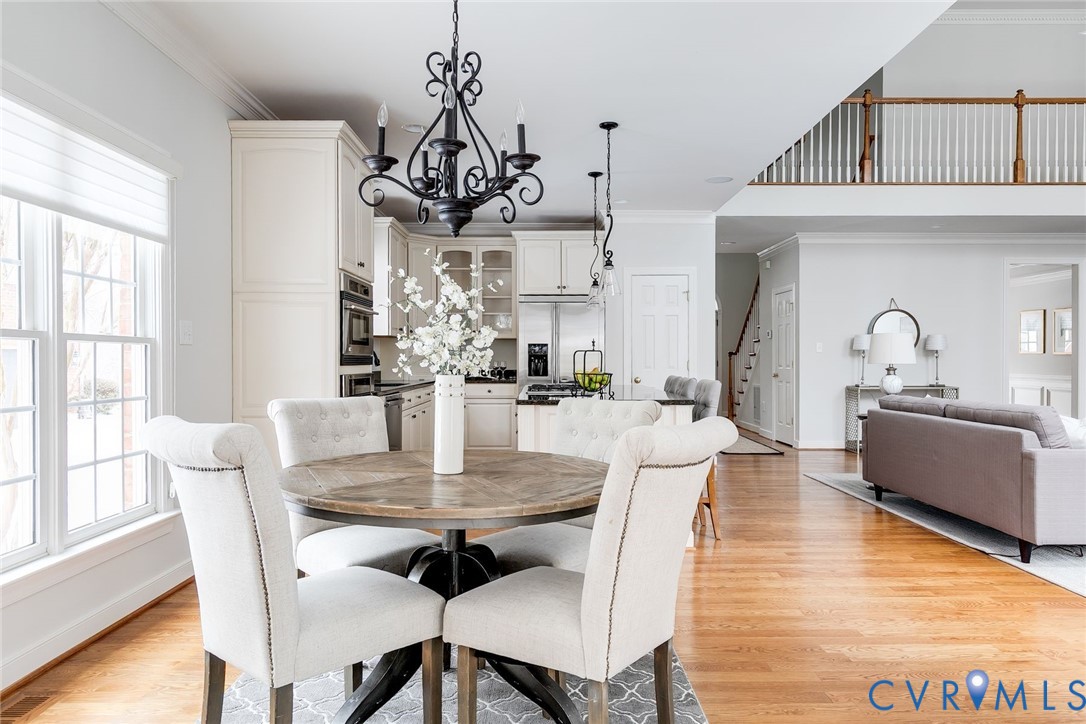 507 Hunt Field Road Manakin-Sabot, VA 23103 - Photo 21 of 43 a view of a dining room with furniture wooden floor and chandelier