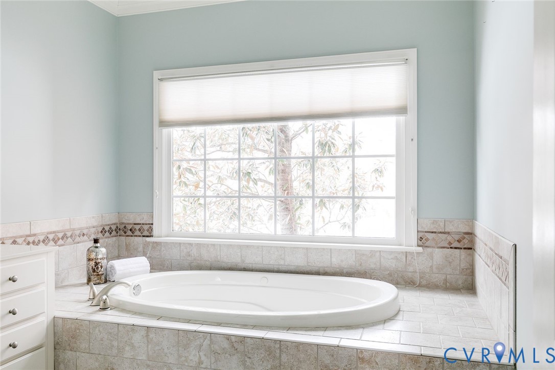 507 Hunt Field Road Manakin-Sabot, VA 23103 - Photo 27 of 43 a white bath tub sitting in a bathroom next to a window