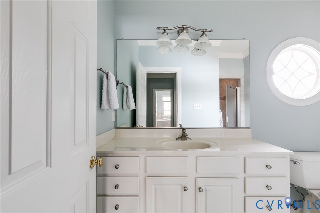 507 Hunt Field Road Manakin-Sabot, VA 23103 - Photo 29 of 43 a bathroom with a sink and a mirror