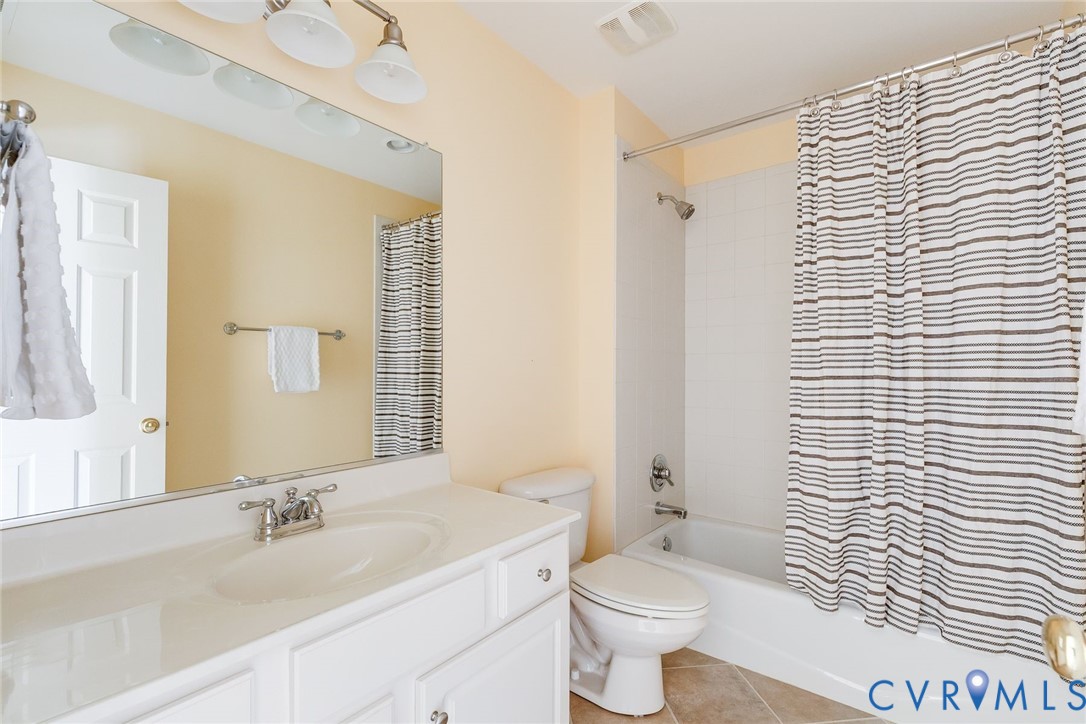 507 Hunt Field Road Manakin-Sabot, VA 23103 - Photo 34 of 43 a bathroom with a sink a toilet and shower curtain