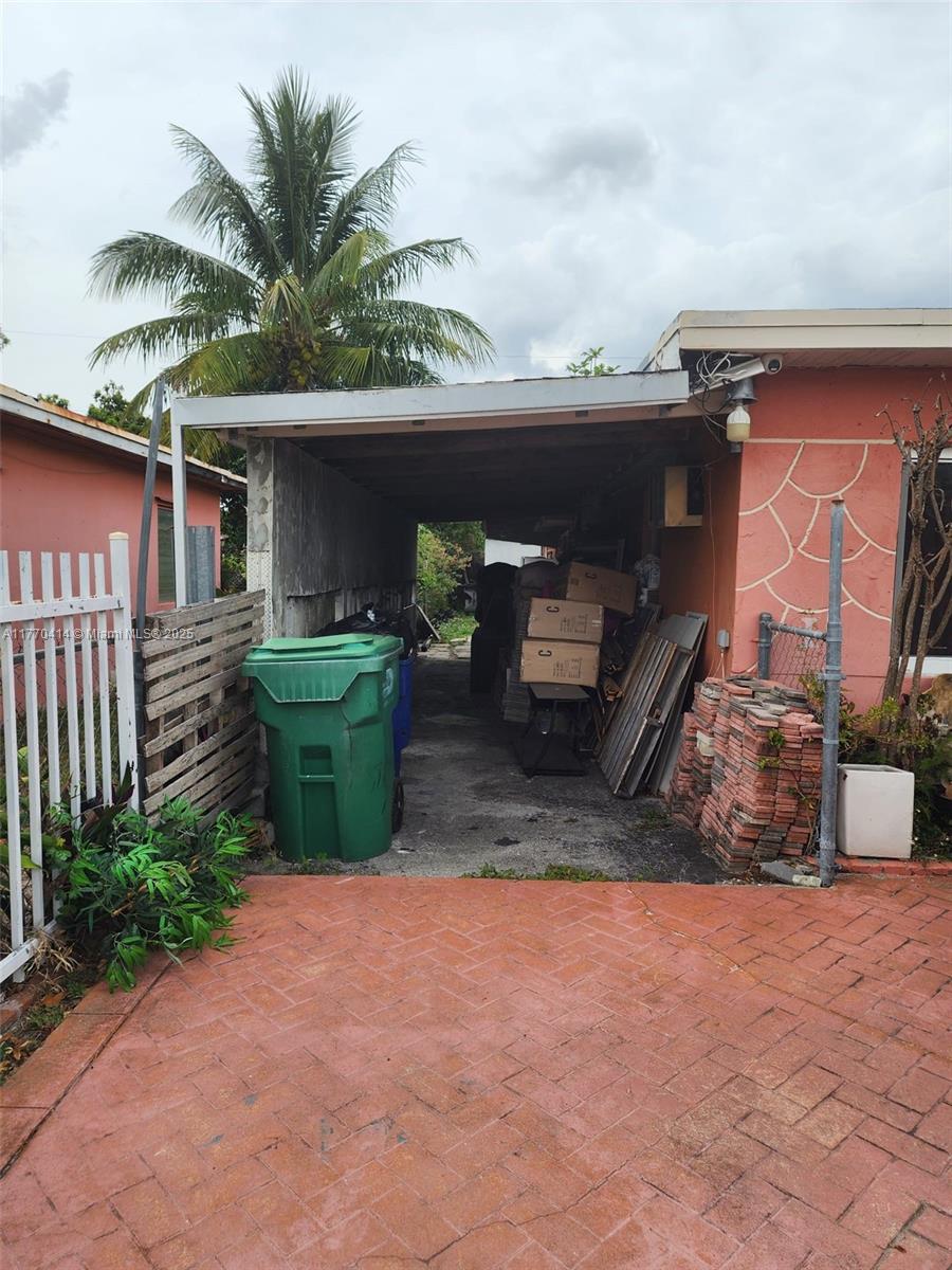 831 Northwest 140th Street Miami, FL 33168 - Photo 14 of 19 a front view of a house with garden