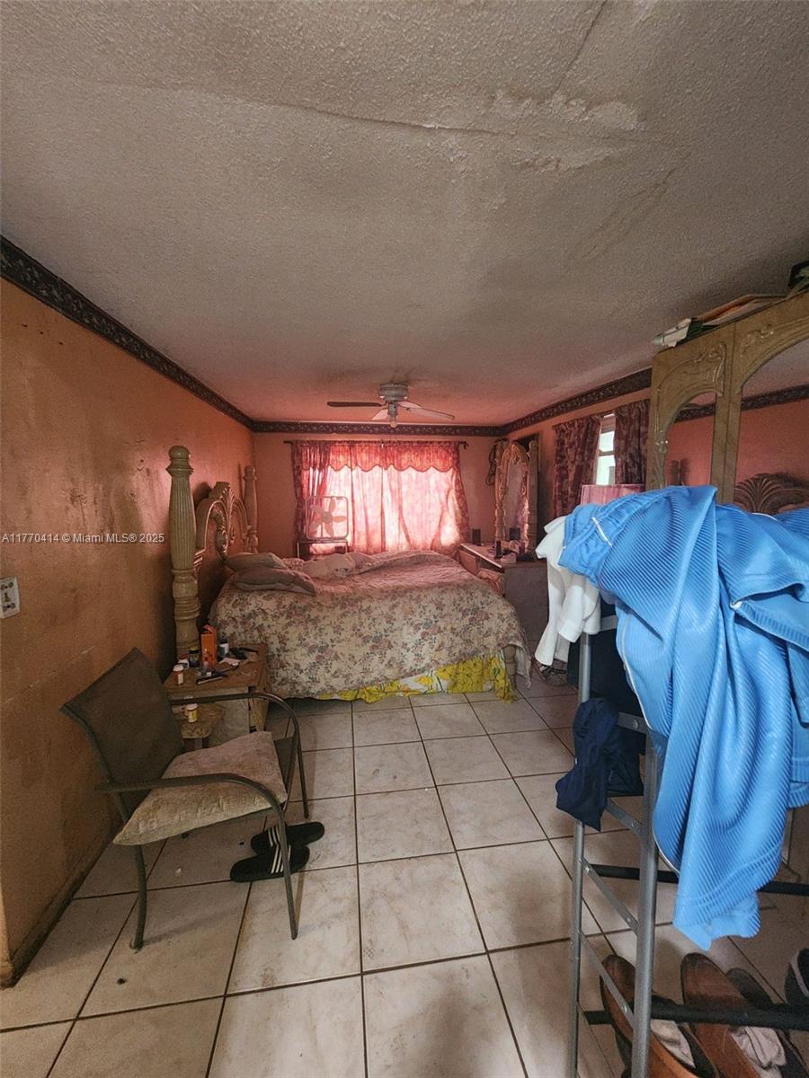 831 Northwest 140th Street Miami, FL 33168 - Photo 10 of 19 a kitchen with a sink and cabinets