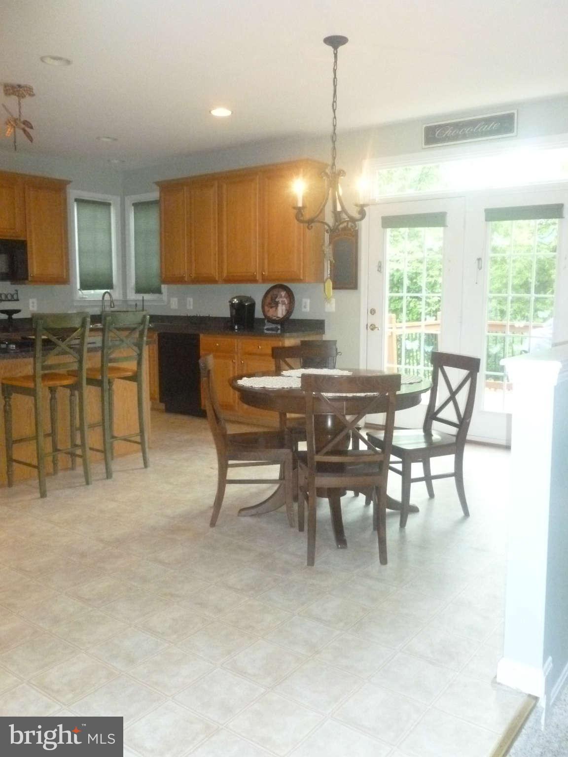 24822 Serpentine Place Stone Ridge, VA 20105 - Photo 14 of 29 a view of a dining room with furniture