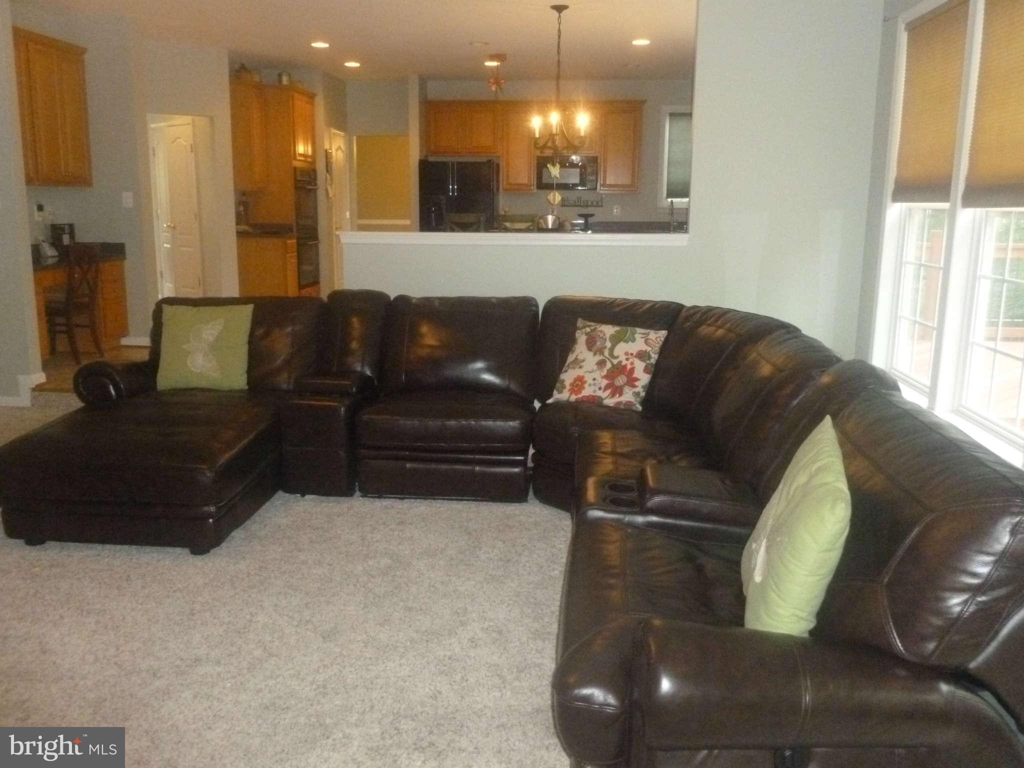 24822 Serpentine Place Stone Ridge, VA 20105 - Photo 8 of 29 a living room with furniture and a large window
