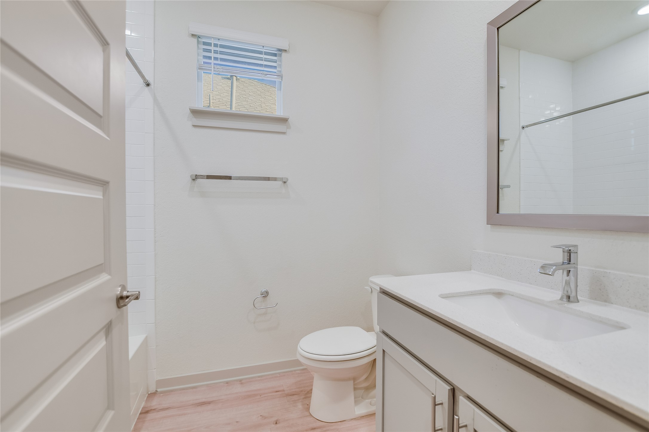 2244 Alamar Walk Leander, TX 78641 - Photo 11 of 22 a bathroom with a sink a toilet and vanity