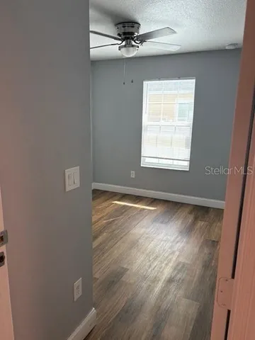 an empty room with a empty space and a window