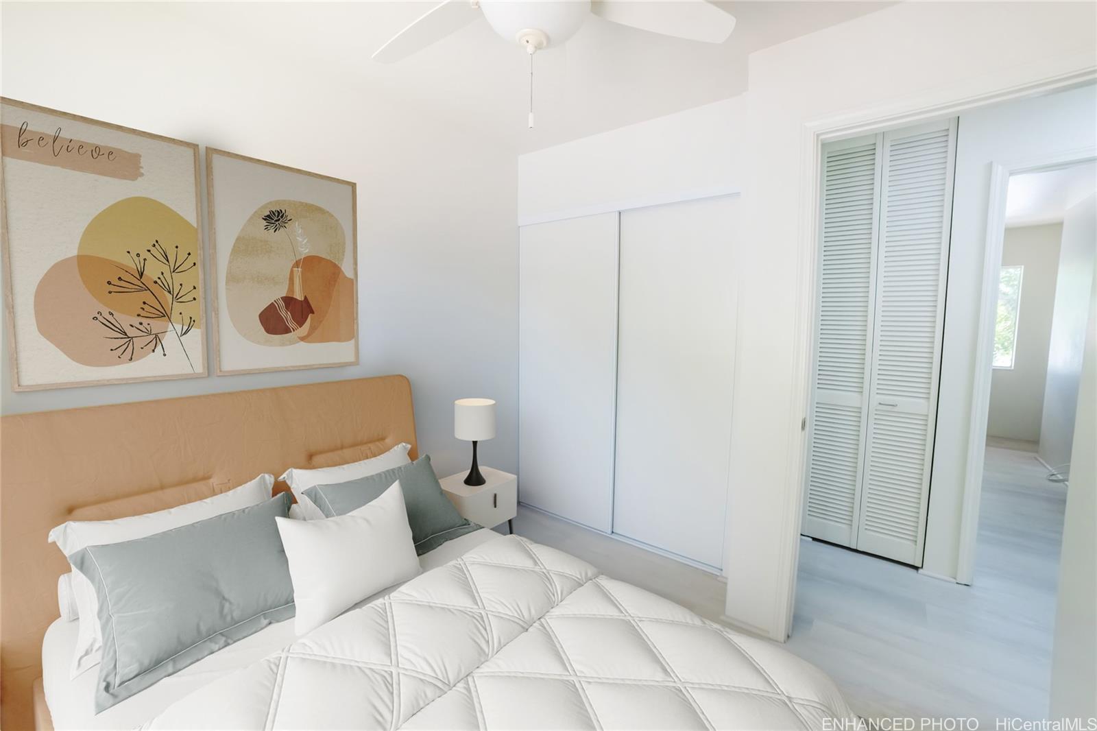 91-1147 Kamaaha Loop, Unit 6F Kapolei, HI 96707 - Photo 15 of 25 a bedroom with a bed and painting on the wall