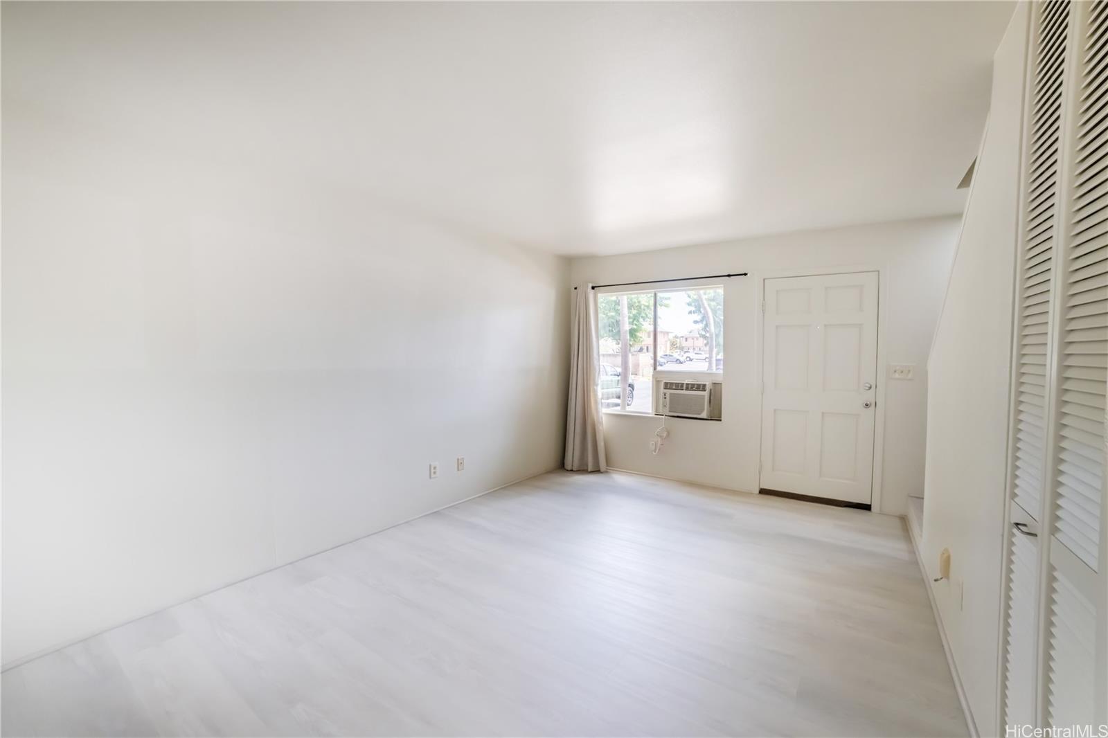 91-1147 Kamaaha Loop, Unit 6F Kapolei, HI 96707 - Photo 2 of 25 an empty room with windows