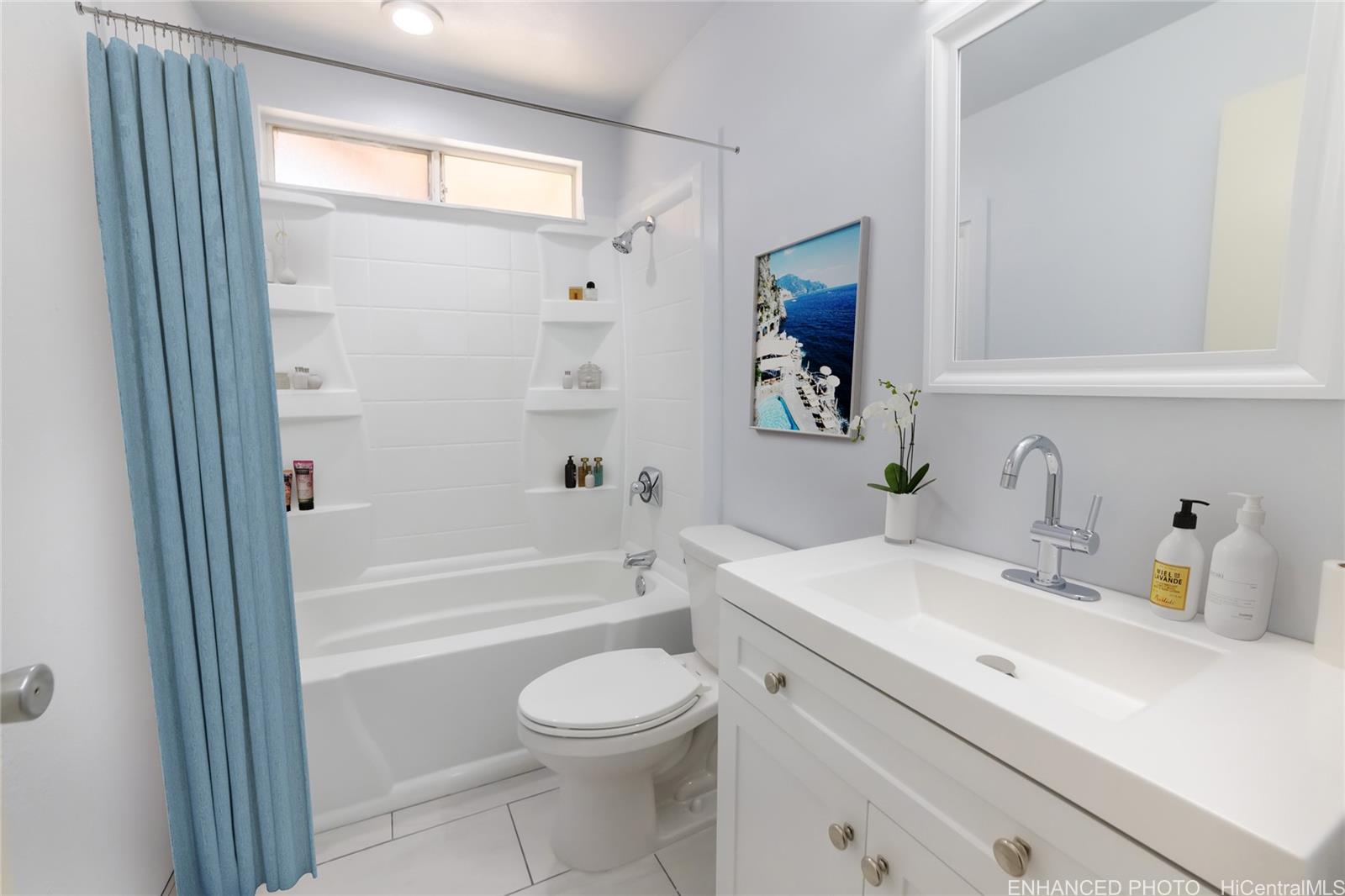 91-1147 Kamaaha Loop, Unit 6F Kapolei, HI 96707 - Photo 21 of 25 a bathroom with a sink a toilet and a bathtub