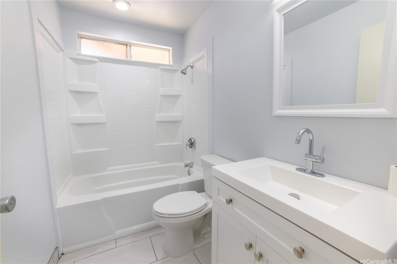 91-1147 Kamaaha Loop, Unit 6F Kapolei, HI 96707 - Photo 22 of 25 a bathroom with a sink a toilet and shower