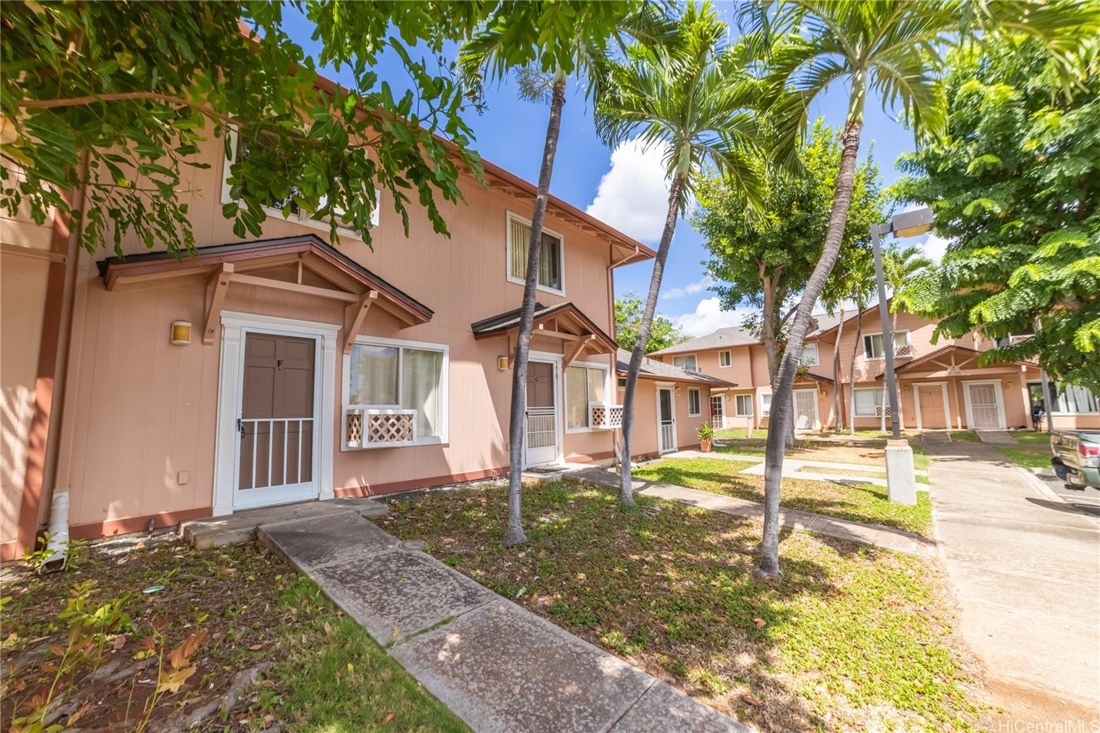 91-1147 Kamaaha Loop, Unit 6F Kapolei, HI 96707 - Photo 24 of 25 a front view of a house with a yard