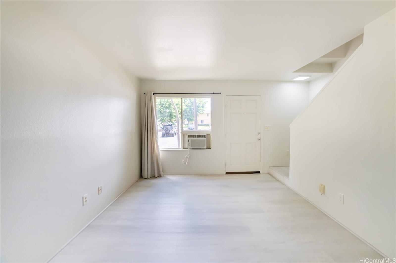 91-1147 Kamaaha Loop, Unit 6F Kapolei, HI 96707 - Photo 5 of 25 an empty room with windows