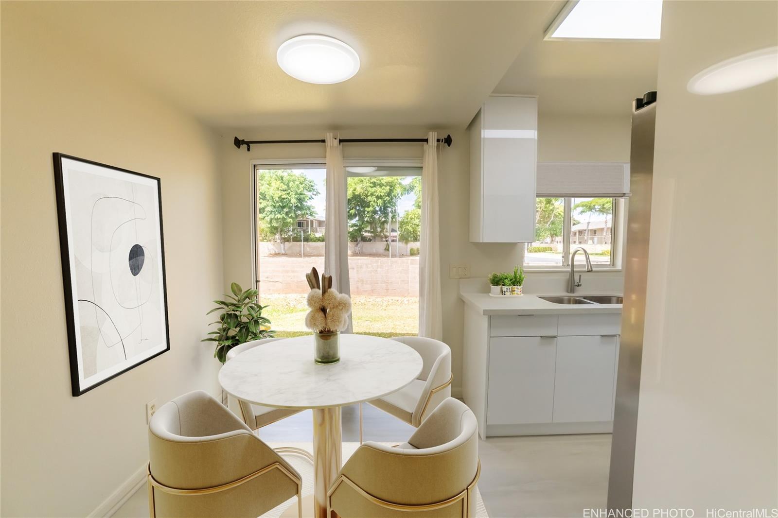 91-1147 Kamaaha Loop, Unit 6F Kapolei, HI 96707 - Photo 6 of 25 a kitchen with a table and chairs in it