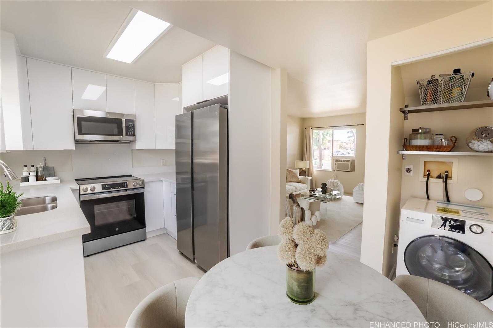 91-1147 Kamaaha Loop, Unit 6F Kapolei, HI 96707 - Photo 10 of 25 a kitchen with a refrigerator a stove and a sink