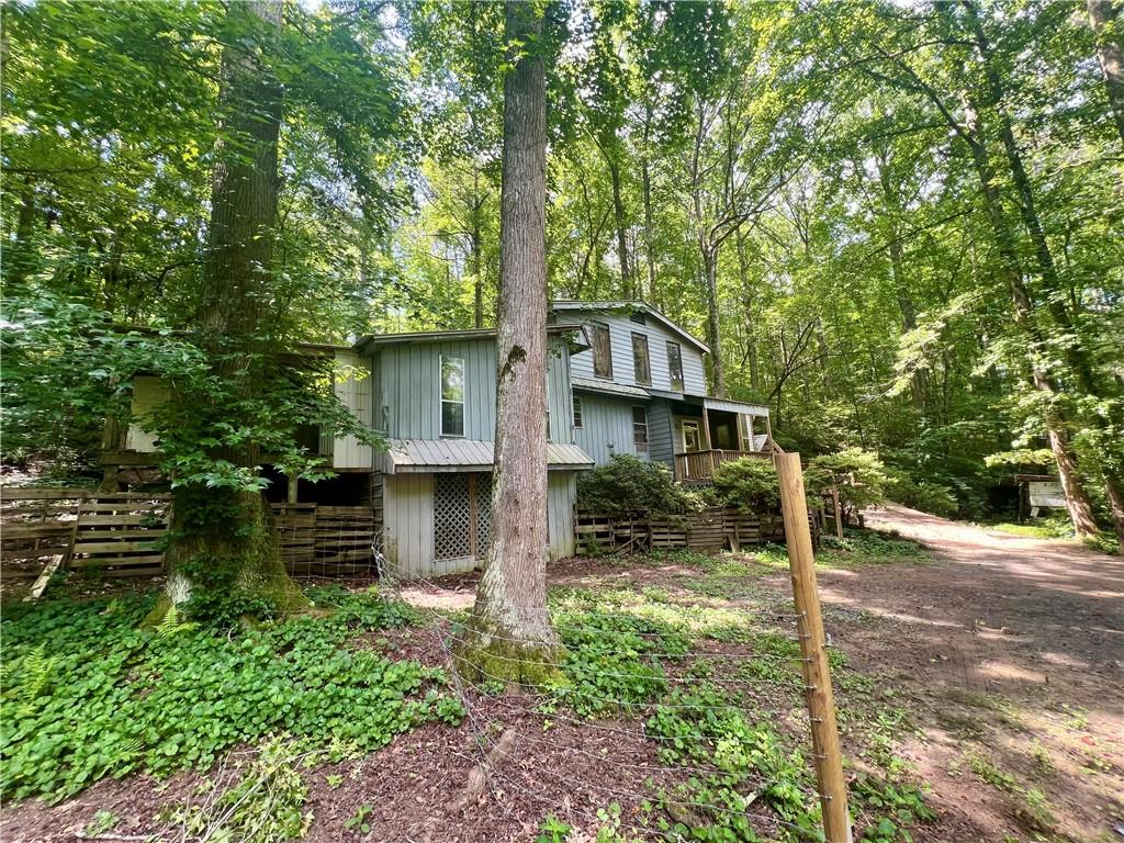 579 Banner Circle Ellijay, GA 30540 - Photo 4 of 13 a front view of a house with a garden