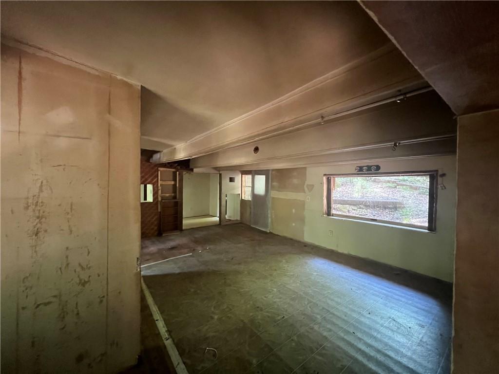 579 Banner Circle Ellijay, GA 30540 - Photo 7 of 13 a view of an empty room with window and wooden floor