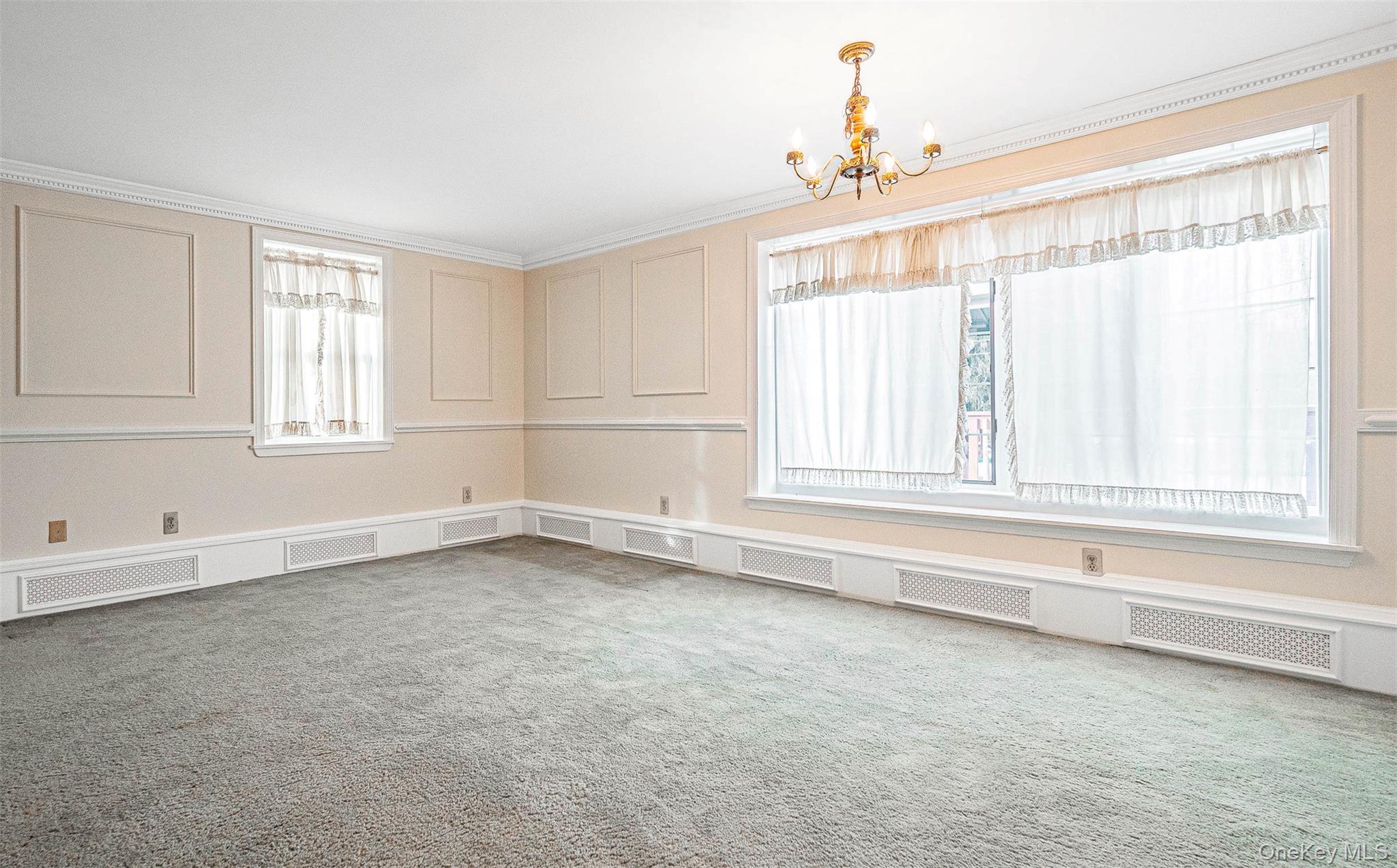 238 South Centerville Road Middletown, NY 10940 - Photo 7 of 30 Dining room featuring a decorative wall and a chandelier
