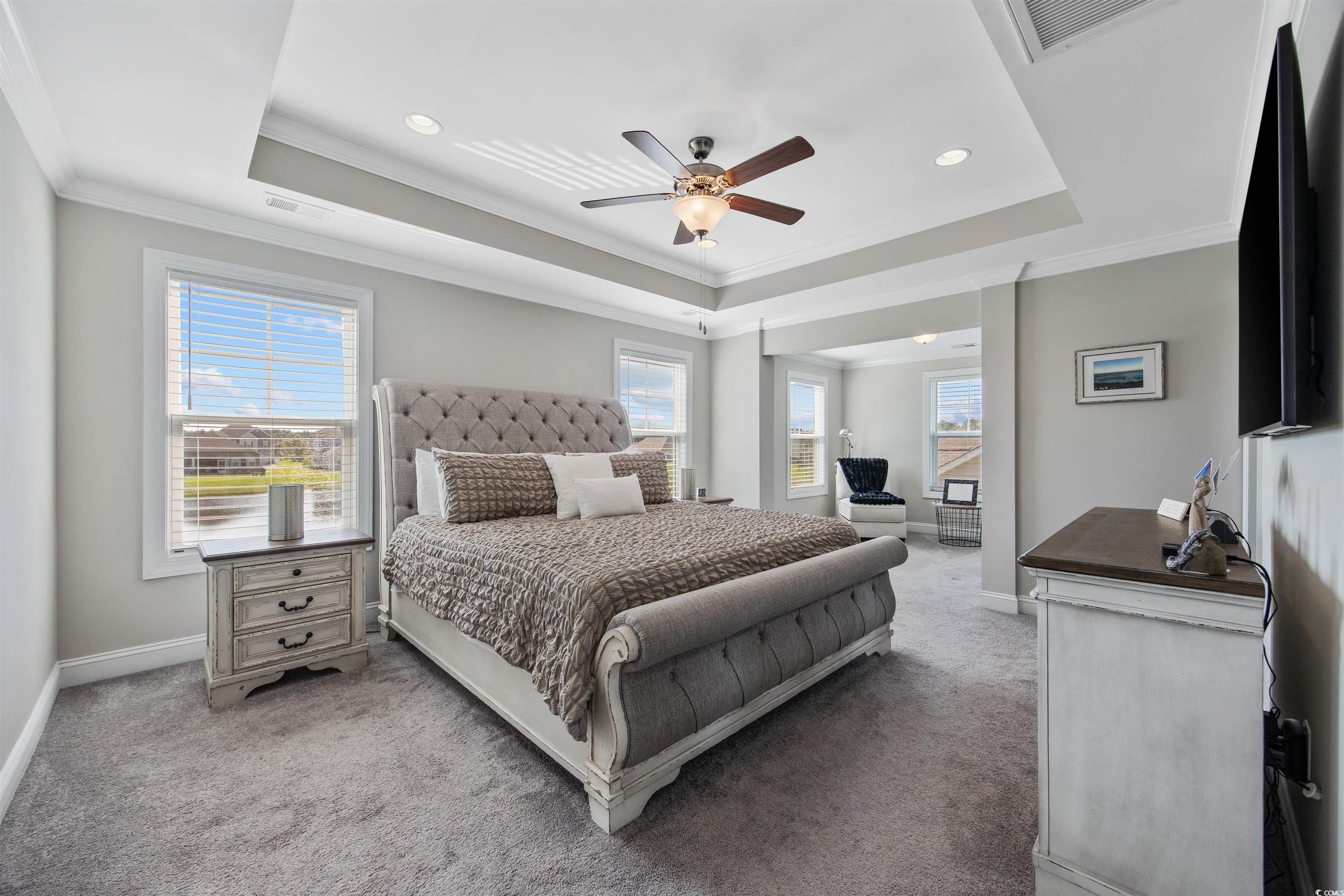 5286 Stockyard Loop Myrtle Beach, SC 29588 - Photo 28 of 40 Carpeted bedroom featuring a tray ceiling, crown molding, a ceiling fan, and recessed lighting