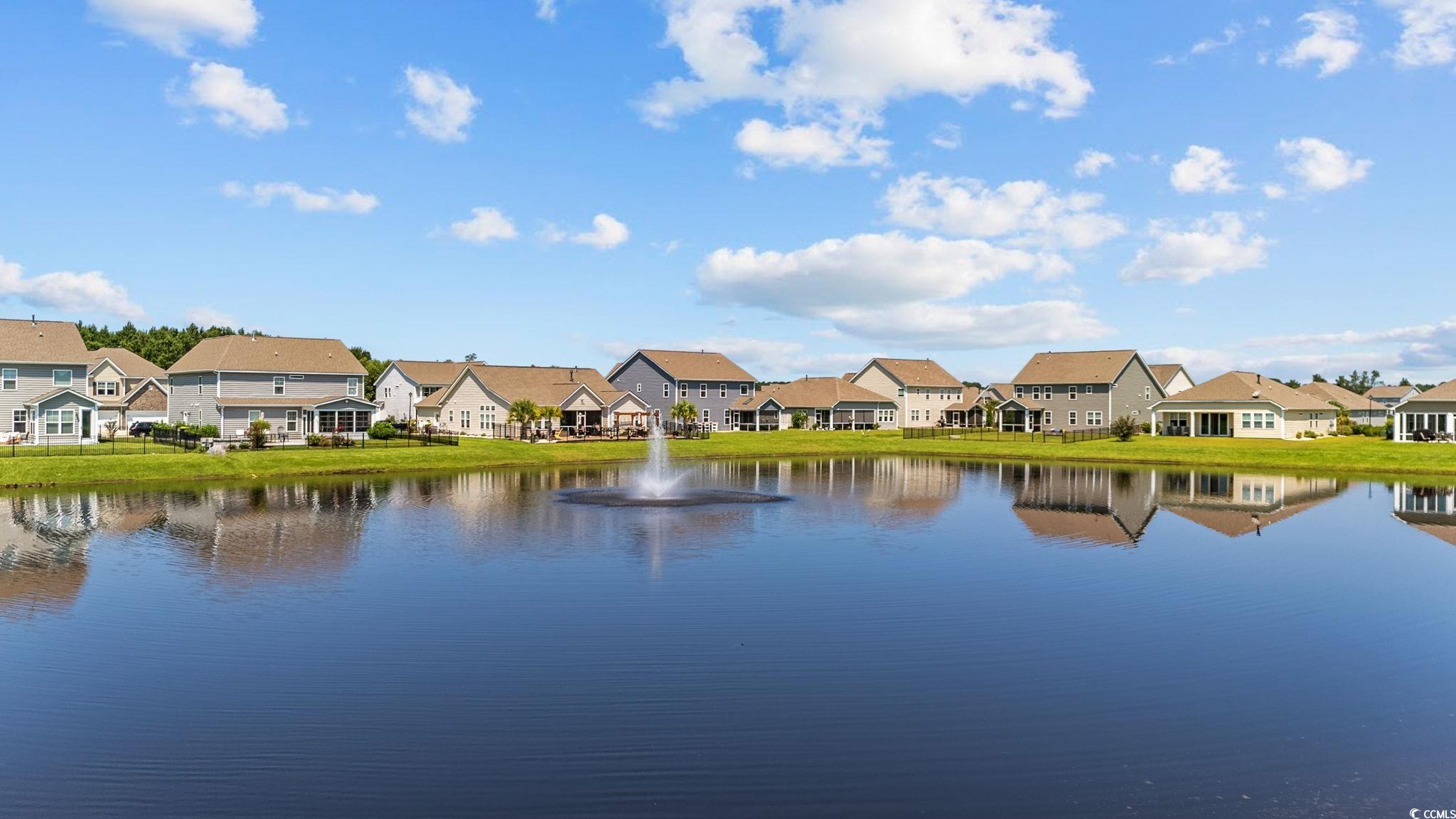 Water view featuring nearby suburban area