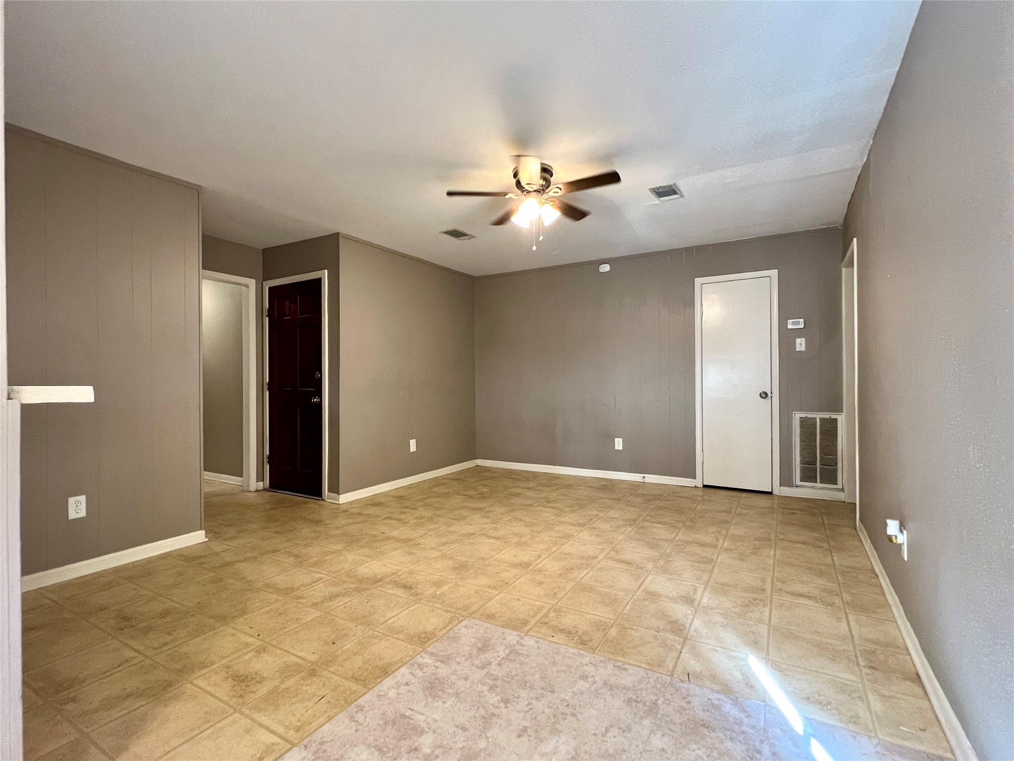 12819 Claygate Drive Houston, TX 77047 - Photo 4 of 12 a view of an empty room and chandelier fan