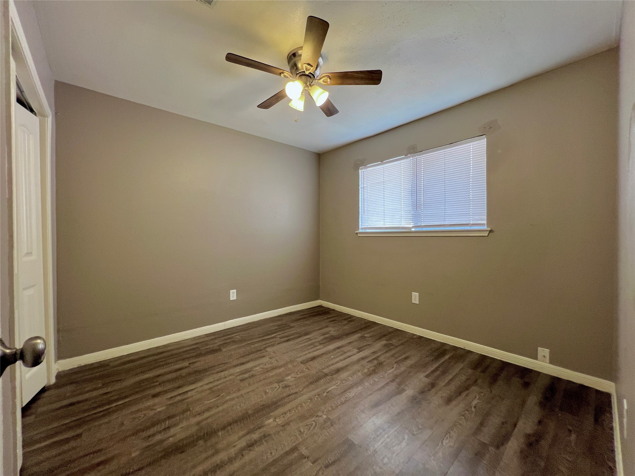 12819 Claygate Drive Houston, TX 77047 - Photo 9 of 12 wooden floor in an empty room with a window
