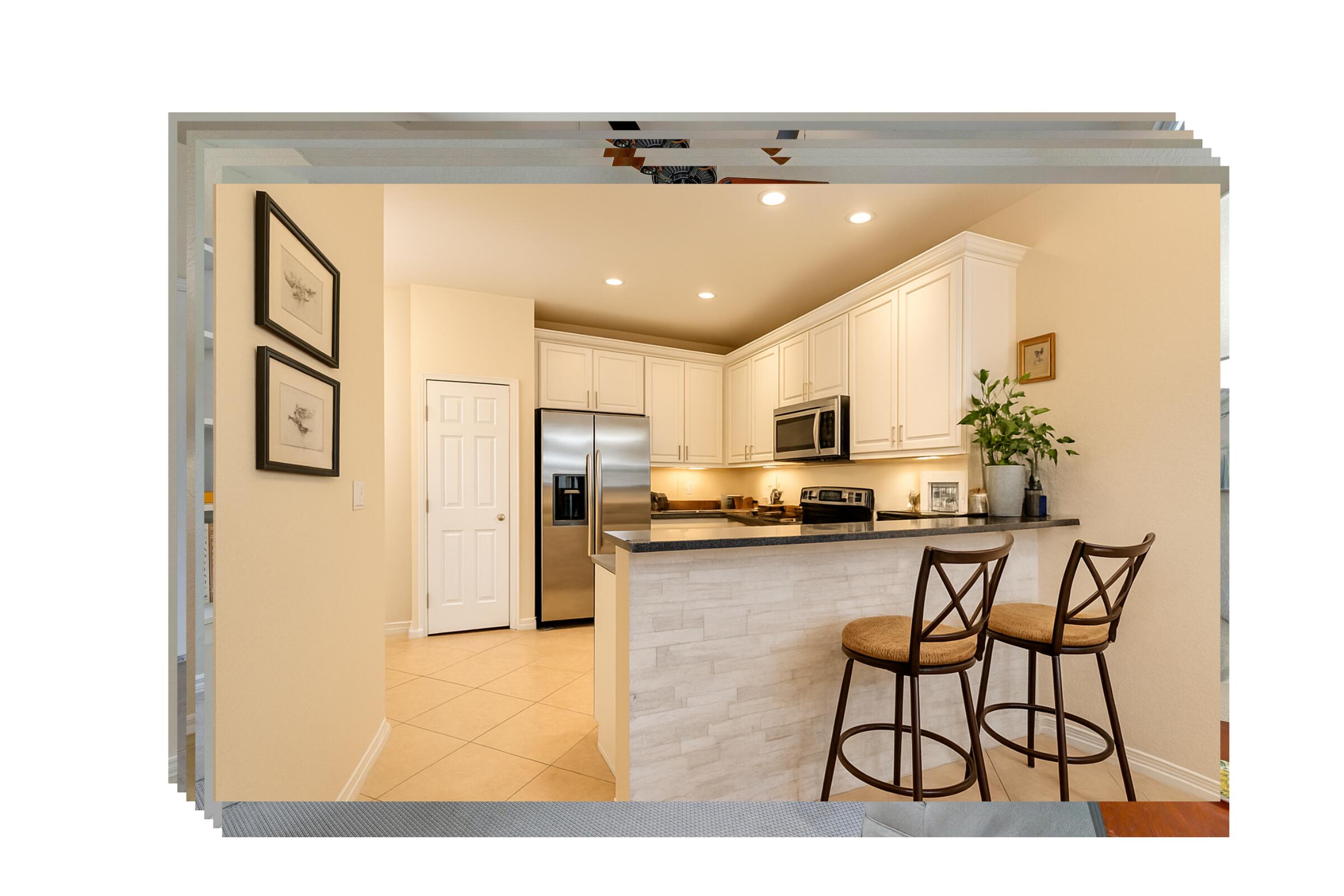 115 Pond Apple Lane, Unit 105 Jupiter, FL 33458 - Photo 14 of 38 a kitchen with stainless steel appliances kitchen island granite countertop a refrigerator and microwave