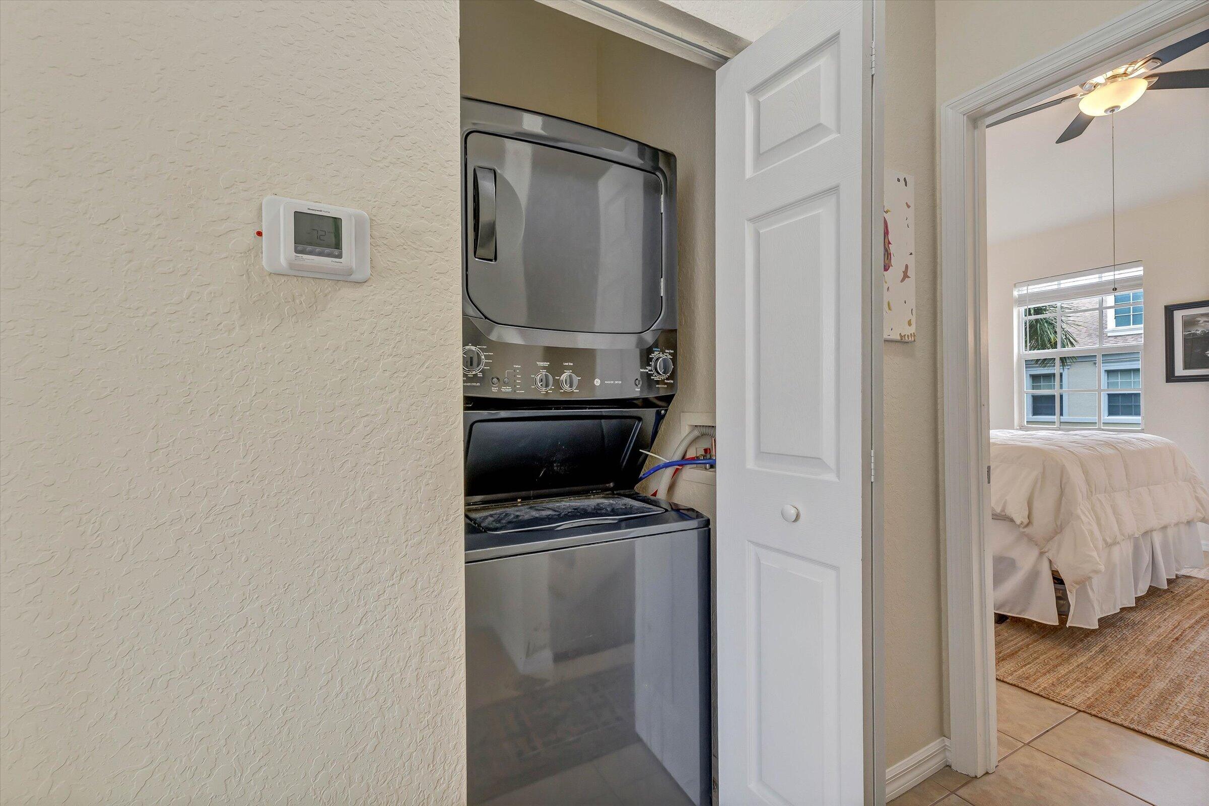 115 Pond Apple Lane, Unit 105 Jupiter, FL 33458 - Photo 38 of 38 a en suite bathroom with a sink and mirror