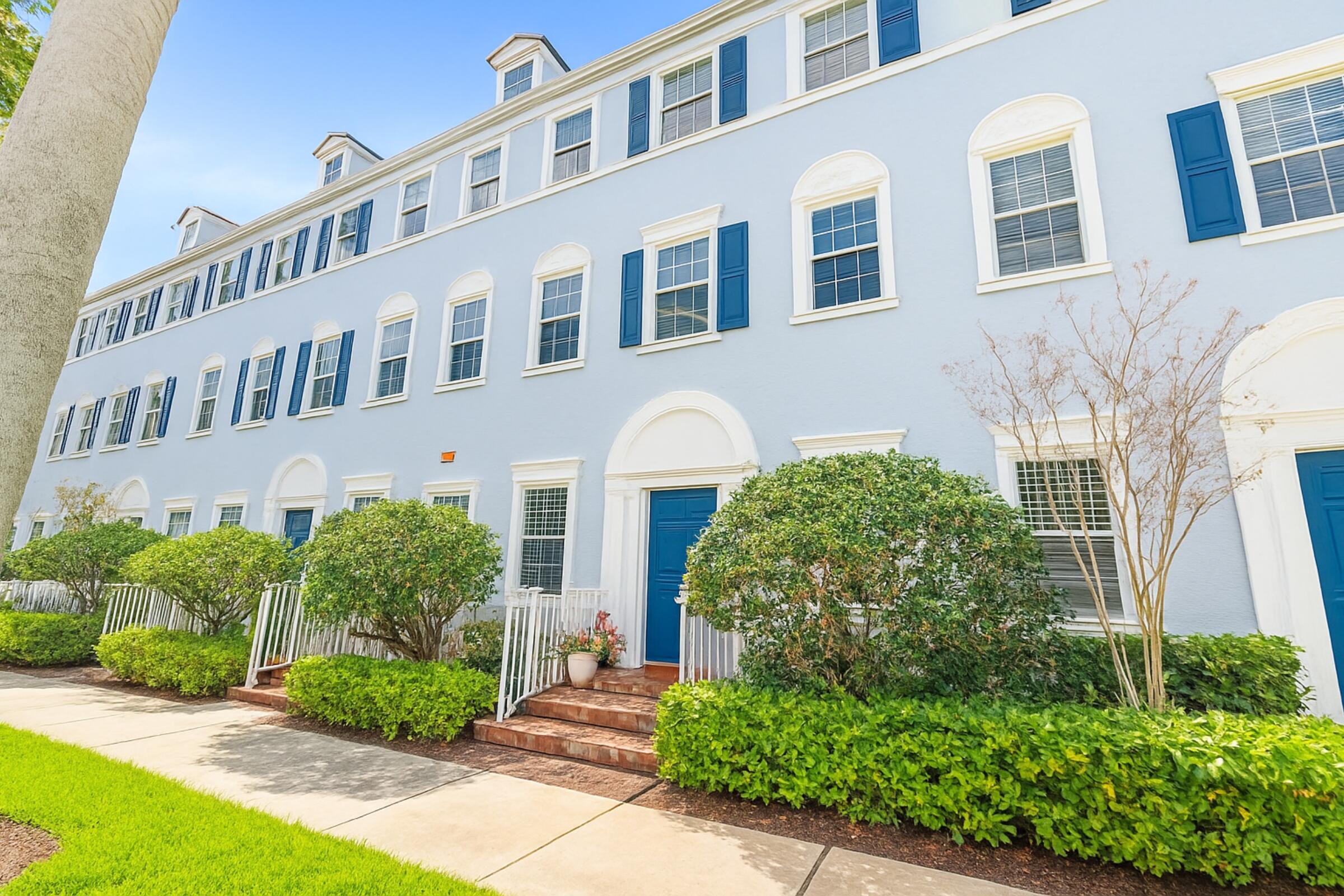 115 Pond Apple Lane, Unit 105 Jupiter, FL 33458 - Photo 4 of 38 a front view of a house with garden