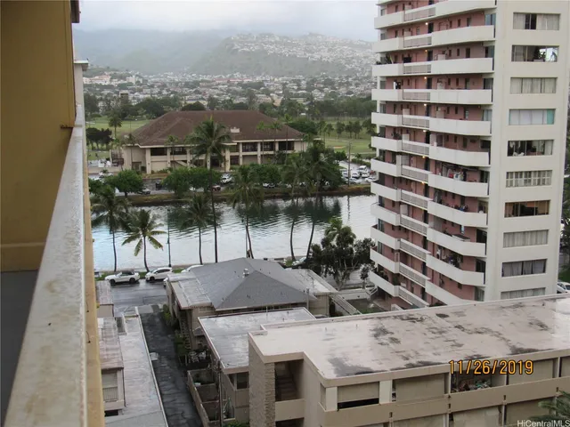 a view of a balcony and wooden floor