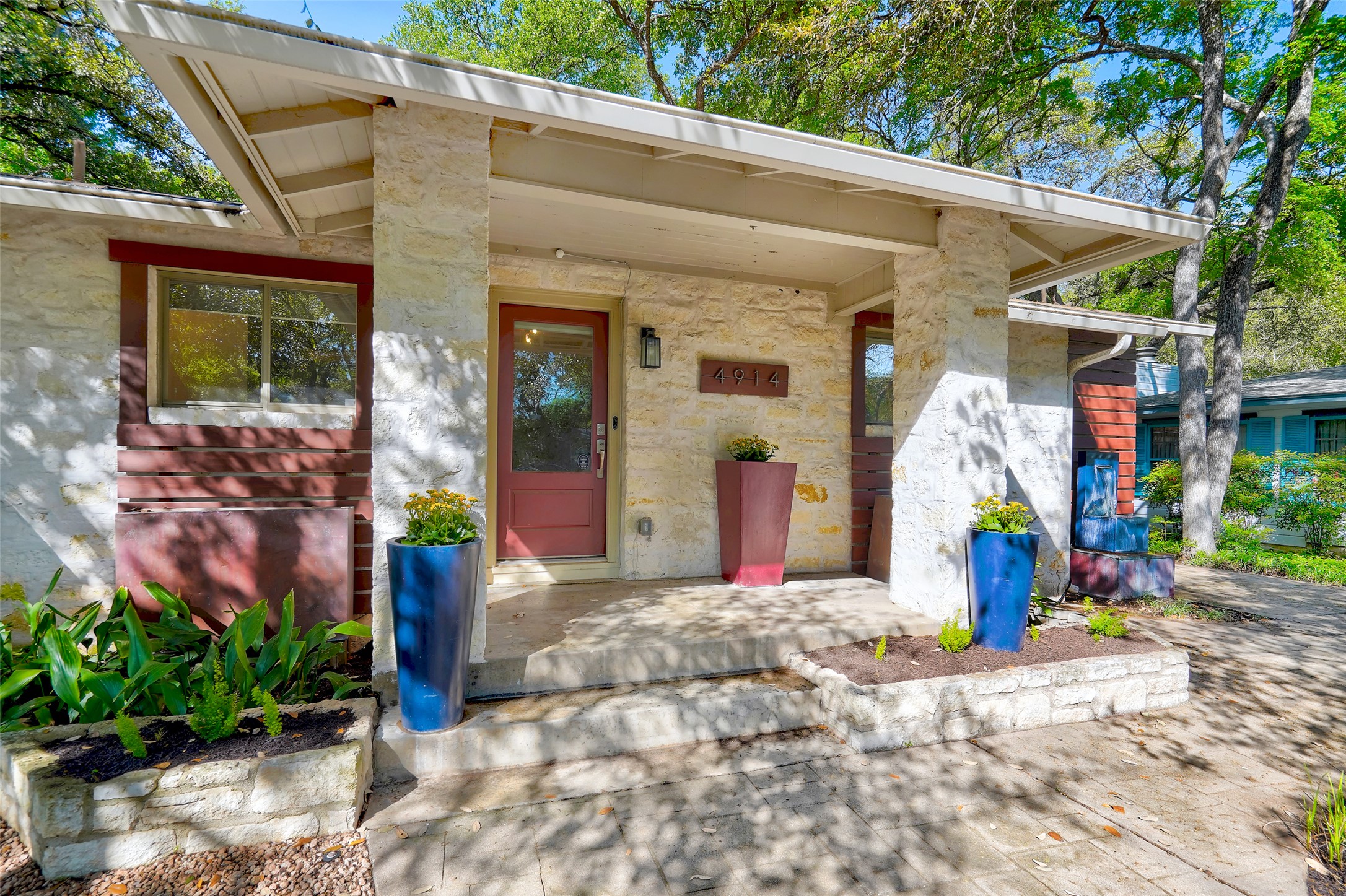 Doorway to property featuring stone siding
