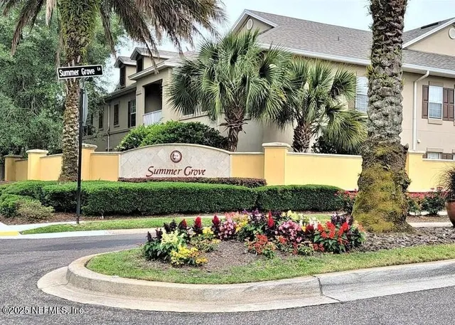 a view of a fountain in front of a house