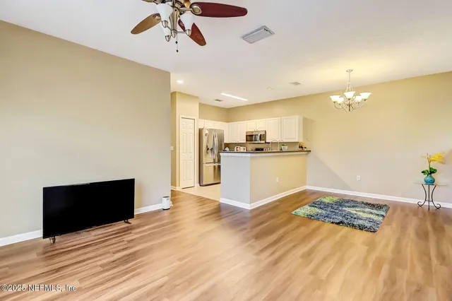 a view of a kitchen with a stove cabinets and wooden floor