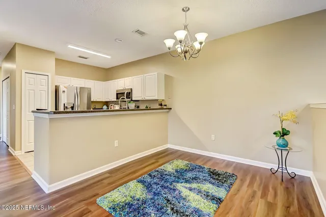 a view of a kitchen from the hallway