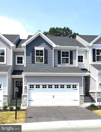 a front view of a house with yard