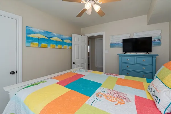 a room that has a bed and a flat screen tv