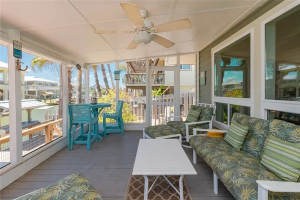 a living room with furniture a table and chairs