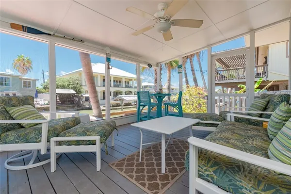 a outdoor space with patio the couches and a dining table with the view of living room