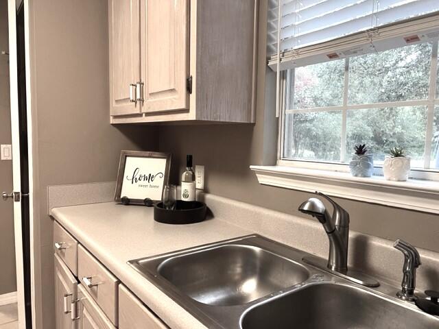 1860 Eagle Lane Navarre, FL 32566 - Photo 11 of 34 a kitchen with a sink and a window