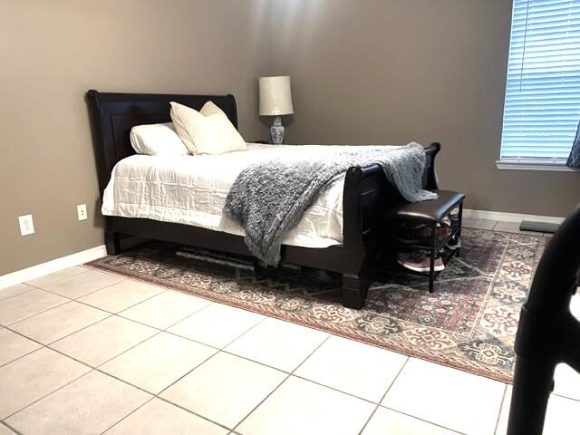 1860 Eagle Lane Navarre, FL 32566 - Photo 16 of 34 a bedroom with a bed and a rug