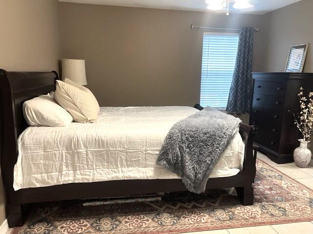 1860 Eagle Lane Navarre, FL 32566 - Photo 17 of 34 a bedroom with a bed mirror and window