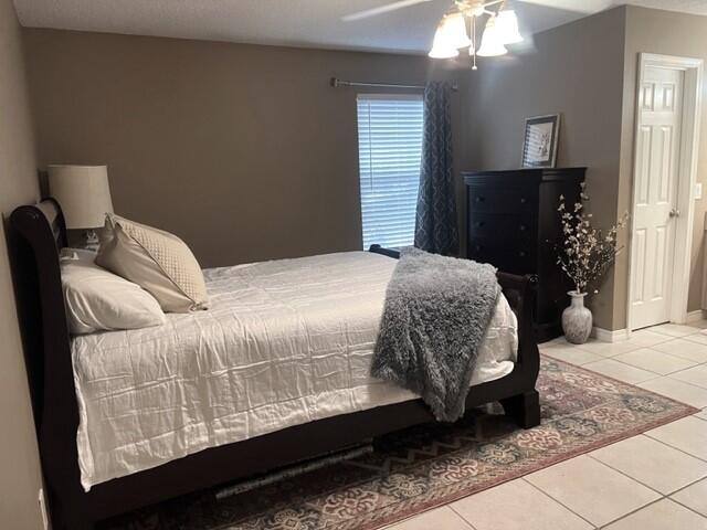 1860 Eagle Lane Navarre, FL 32566 - Photo 18 of 34 a bedroom with a bed and wooden floor