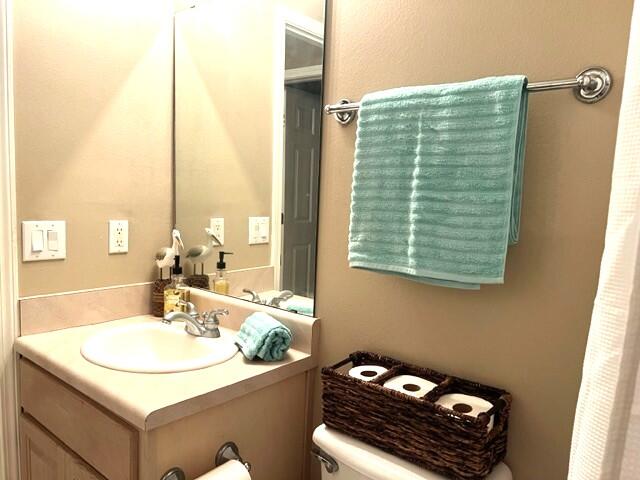 1860 Eagle Lane Navarre, FL 32566 - Photo 24 of 34 a bathroom with a sink and a mirror