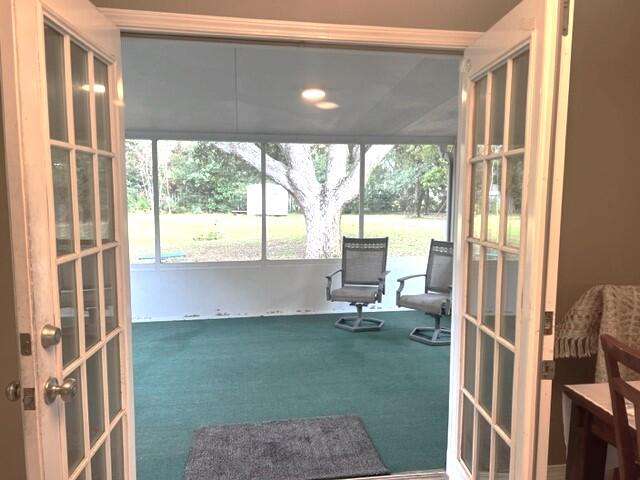 1860 Eagle Lane Navarre, FL 32566 - Photo 25 of 34 a living room with a floor to ceiling window and floor to ceiling window