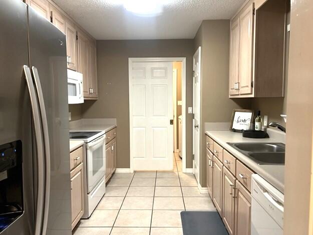 1860 Eagle Lane Navarre, FL 32566 - Photo 9 of 34 a kitchen with stainless steel appliances granite countertop a refrigerator and a sink