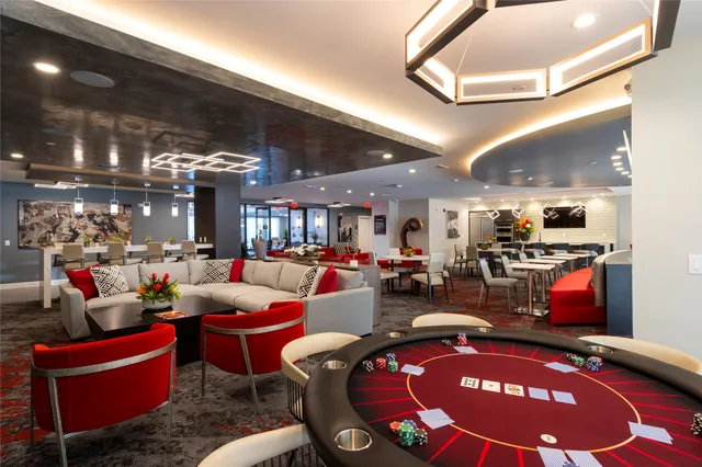 a living room with furniture a rug and a fireplace