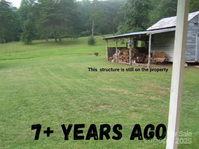 a view of outdoor space with garden and seating area