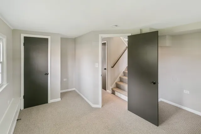 a view of an empty room with stairs