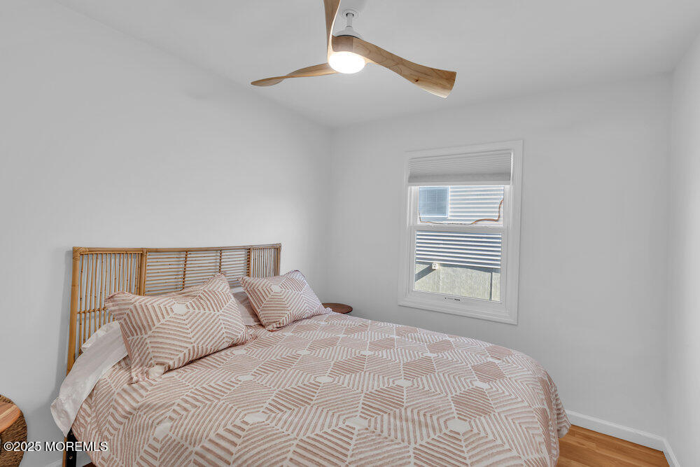 234 3rd Avenue Manasquan, NJ 08736 - Photo 13 of 25 a large bed in a bedroom next to a window