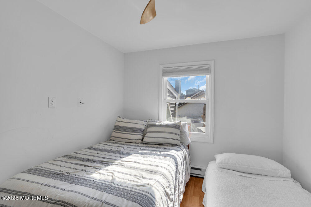 234 3rd Avenue Manasquan, NJ 08736 - Photo 15 of 25 a bedroom with a bed and with a mirror
