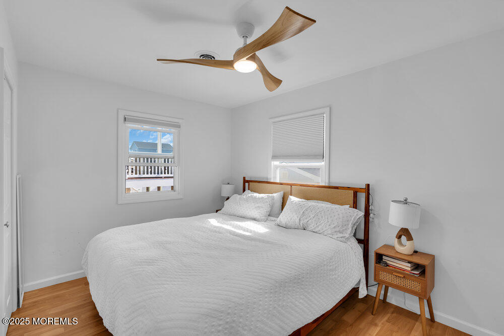 234 3rd Avenue Manasquan, NJ 08736 - Photo 16 of 25 a bedroom with a bed and a window